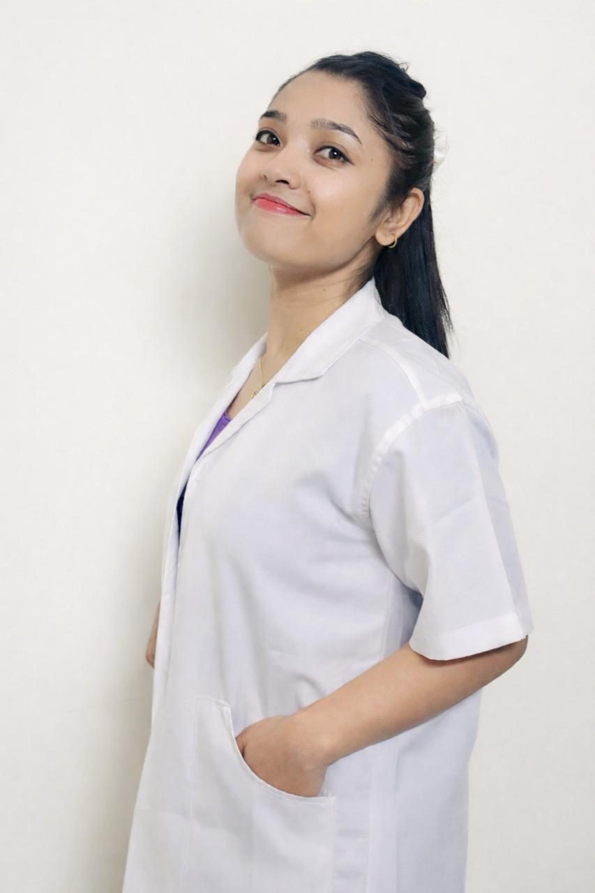 Portrait of Preshna Chettri in a white coat